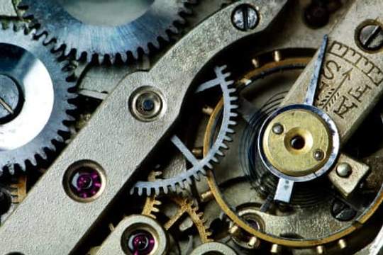 close up of gears in antique watch